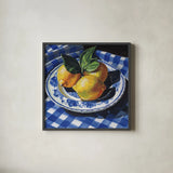 Lemons on a Blue Table by Kate Jarvik Birch. Shown in a sleek black glass frame for a contemporary gallery look. Available as an archival giclee rolled canvas, fine art paper, or poster print. SKU 100948a.