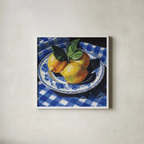 Lemons on a Blue Table by Kate Jarvik Birch. Shown in a crisp white glass frame for a clean and minimalist style. Available as an archival giclee rolled canvas, fine art paper, or poster print. SKU 100948a.