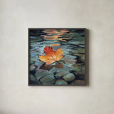 Maple Leaf Floating In a Stream by Kate Jarvik Birch. Shown in a sleek black glass frame for a contemporary gallery look. Available as an archival giclee rolled canvas, fine art paper, or poster print. SKU 101976a.