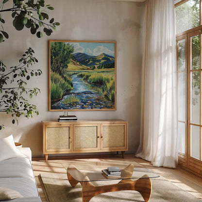 Open Mountain Stream by Kate Jarvik Birch. Shown in a natural wood frame in a cozy modern living room. Available as an archival giclee rolled canvas, fine art paper, or poster print. SKU 99692a.