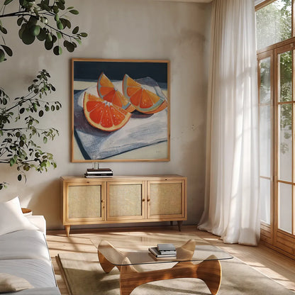 Oranges Catching The Light by Kate Jarvik Birch. Shown in a natural wood frame in a cozy modern living room. Available as an archival giclee rolled canvas, fine art paper, or poster print. SKU 99771a.