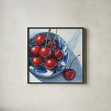 Overhead View of Cherries by Kate Jarvik Birch. Shown in a sleek black glass frame for a contemporary gallery look. Available as an archival giclee rolled canvas, fine art paper, or poster print. SKU 102909a.