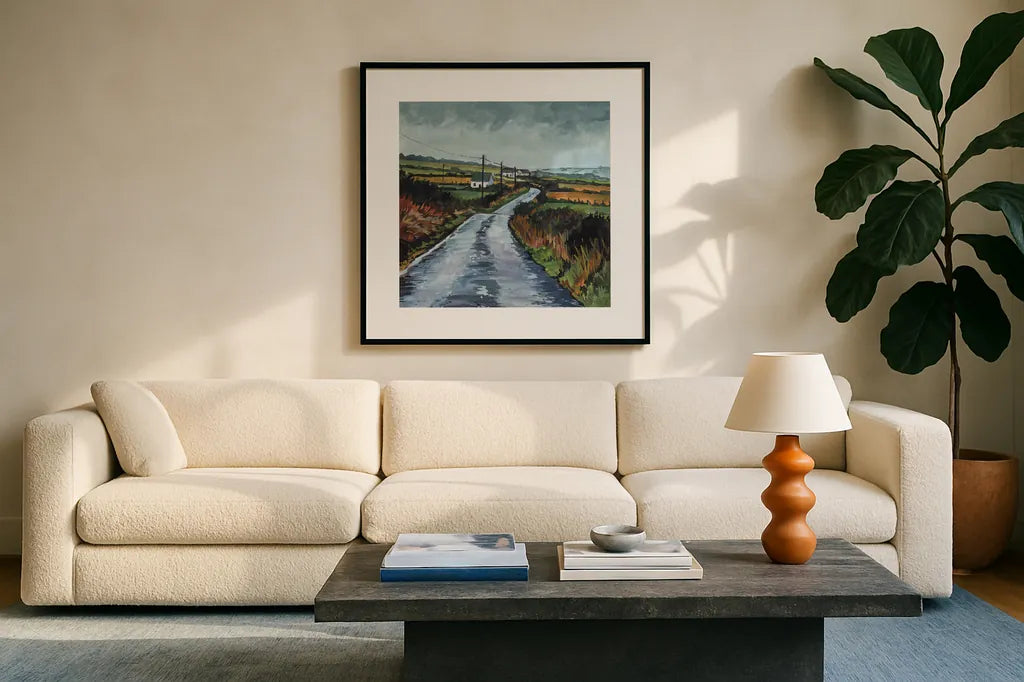 Rainy Back Road by Kate Jarvik Birch. Displayed in a glass frame with matte in a clean modern living room. Available as an archival giclee rolled canvas, fine art paper, or poster print. SKU 100956a.