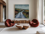 Rainy Back Road by Kate Jarvik Birch. Shown as extra-large giant wall art in a modern living room. Available as an archival giclee rolled canvas, fine art paper, or poster print. SKU 100956a.