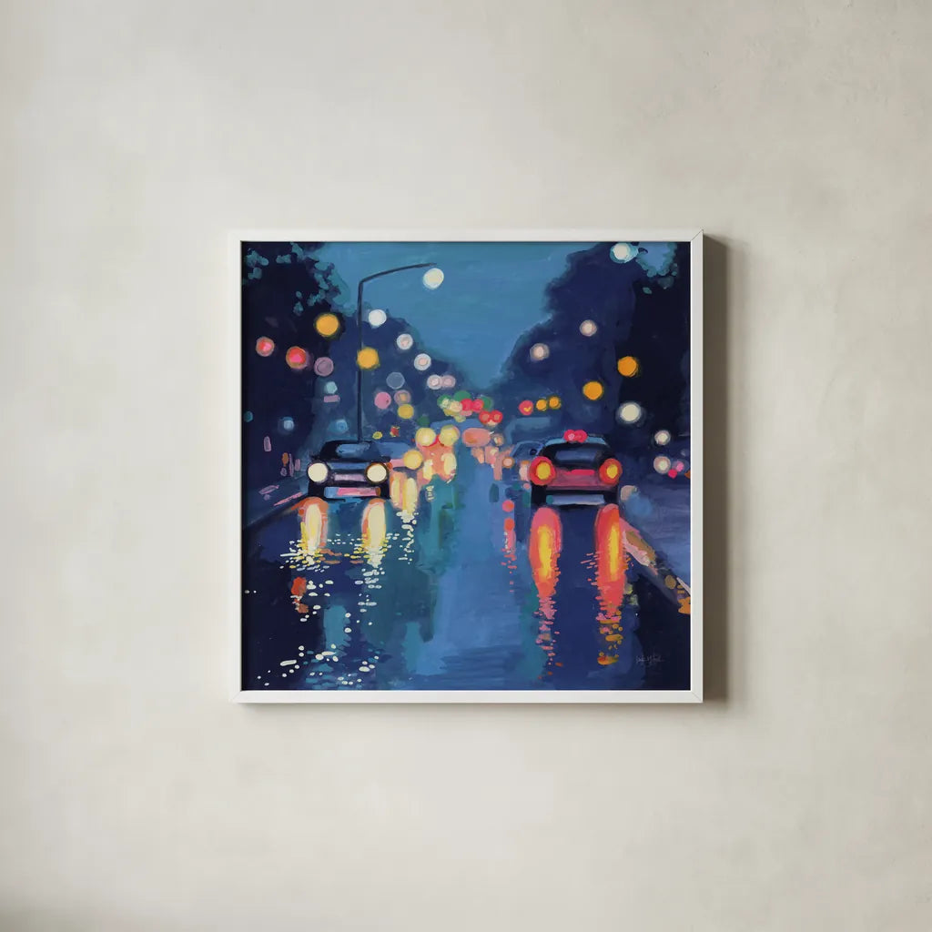 Rainy Drive in The City by Kate Jarvik Birch. Shown in a crisp white glass frame for a clean and minimalist style. Available as an archival giclee rolled canvas, fine art paper, or poster print. SKU 98528a.