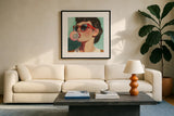 Retro Bubblegum Girl Teal by Kate Jarvik Birch. Displayed in a glass frame with matte in a clean modern living room. Available as an archival giclee rolled canvas, fine art paper, or poster print. SKU 100021a.