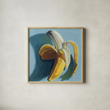 Shady Banana by Kate Jarvik Birch. Shown in a natural wood glass frame for a timeless modern aesthetic. Available as an archival giclee rolled canvas, fine art paper, or poster print. SKU 98611a.