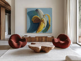 Shady Banana by Kate Jarvik Birch. Shown as extra-large giant wall art in a modern living room. Available as an archival giclee rolled canvas, fine art paper, or poster print. SKU 98611a.