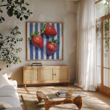 Stripe Cloth Berries by Kate Jarvik Birch. Shown in a natural wood frame in a cozy modern living room. Available as an archival giclee rolled canvas, fine art paper, or poster print. SKU 99767a.