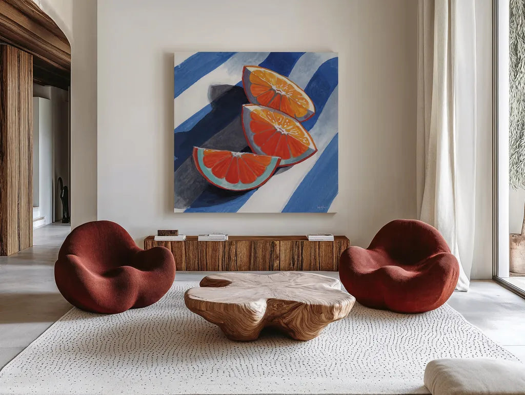 Three Citrus Slices by Kate Jarvik Birch. Shown as extra-large giant wall art in a modern living room. Available as an archival giclee rolled canvas, fine art paper, or poster print. SKU 100964a.