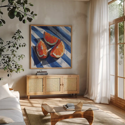 Three Citrus Slices II by Kate Jarvik Birch. Shown in a natural wood frame in a cozy modern living room. Available as an archival giclee rolled canvas, fine art paper, or poster print. SKU 101994a.