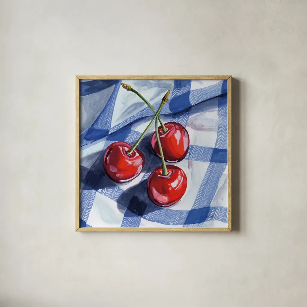 Three Picnic Cherries by Kate Jarvik Birch. Shown in a natural wood glass frame for a timeless modern aesthetic. Available as an archival giclee rolled canvas, fine art paper, or poster print. SKU 98619a.