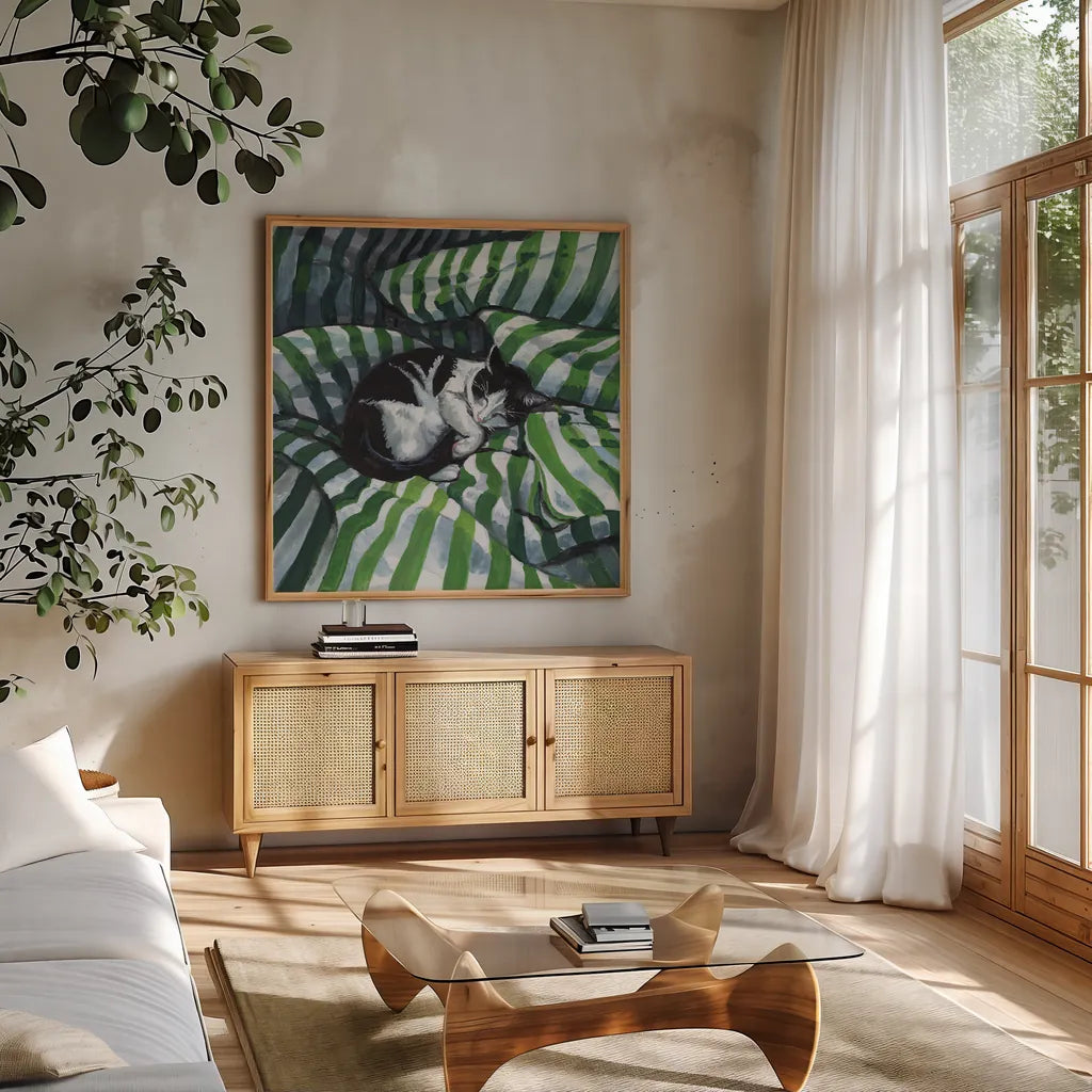 Tuxedo Cat Nap by Kate Jarvik Birch. Shown in a natural wood frame in a cozy modern living room. Available as an archival giclee rolled canvas, fine art paper, or poster print. SKU 100954a.