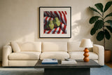 Two Pears on a Striped Cloth by Kate Jarvik Birch. Displayed in a glass frame with matte in a clean modern living room. Available as an archival giclee rolled canvas, fine art paper, or poster print. SKU 100949a.