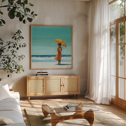 Umbrella at the Beach by Kate Jarvik Birch. Shown in a natural wood frame in a cozy modern living room. Available as an archival giclee rolled canvas, fine art paper, or poster print. SKU 100959a.