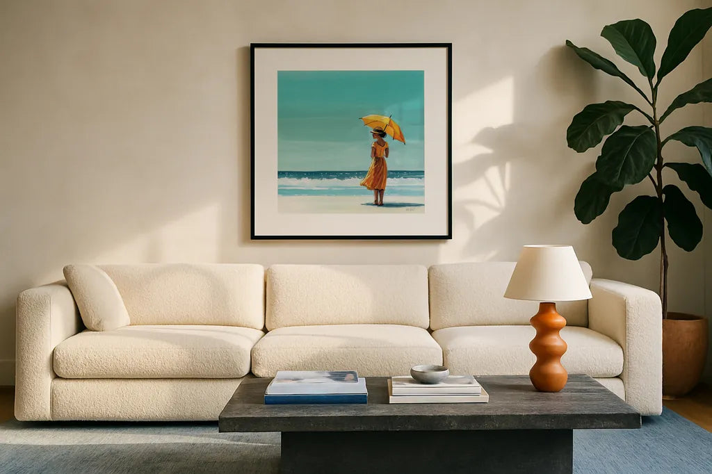 Umbrella at the Beach by Kate Jarvik Birch. Displayed in a glass frame with matte in a clean modern living room. Available as an archival giclee rolled canvas, fine art paper, or poster print. SKU 100959a.