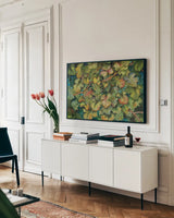 Chardonnay Grapes by Kathleen Parr McKenna. shown as a framed stretched canvas in a living room above a console. Available as a archival giclee rolled canvas, fine art paper, or poster print. SKU 29606i.