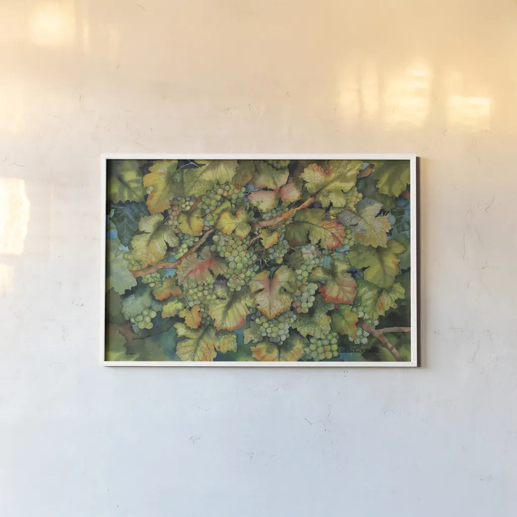 Chardonnay Grapes by Kathleen Parr McKenna. shown as a paper print in a white frame. Available as a archival giclee rolled canvas, fine art paper, or poster print. SKU 29606i.