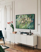 Chickadees by Kathleen Parr McKenna. shown as a framed stretched canvas in a living room above a console. Available as a archival giclee rolled canvas, fine art paper, or poster print. SKU 29600i.