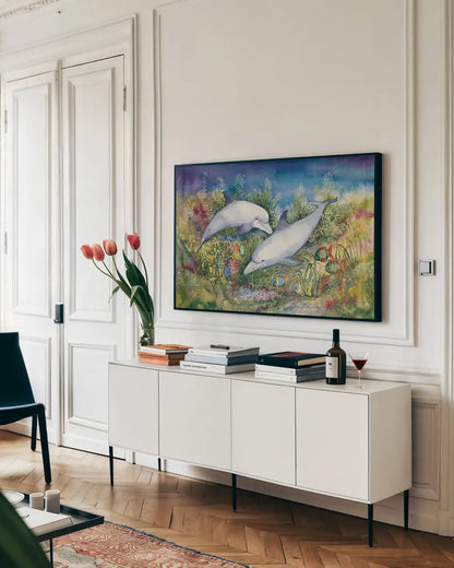 Dolphin Duo by Kathleen Parr McKenna. shown as a framed stretched canvas in a living room above a console. Available as a archival giclee rolled canvas, fine art paper, or poster print. SKU 41273i.