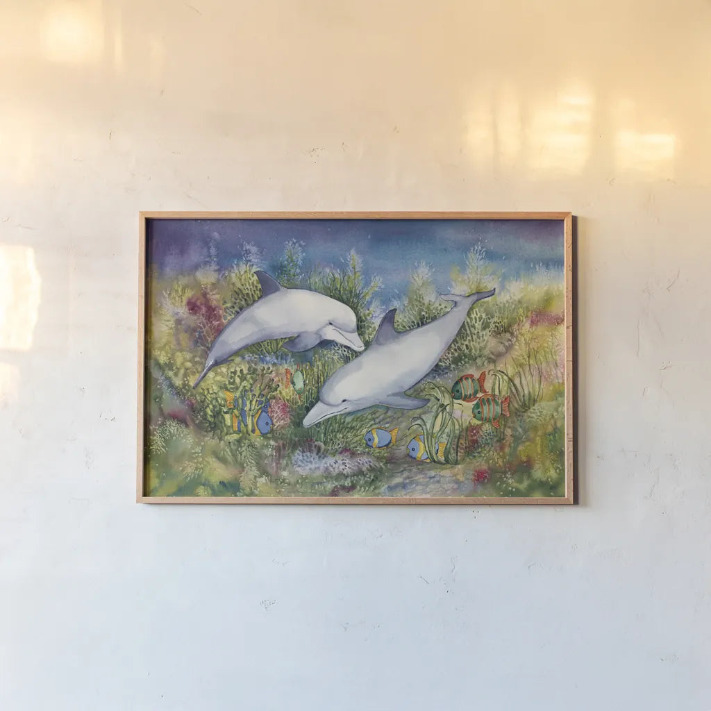 Dolphin Duo by Kathleen Parr McKenna. shown as a paper print in a natural frame. Available as a archival giclee rolled canvas, fine art paper, or poster print. SKU 41273i.