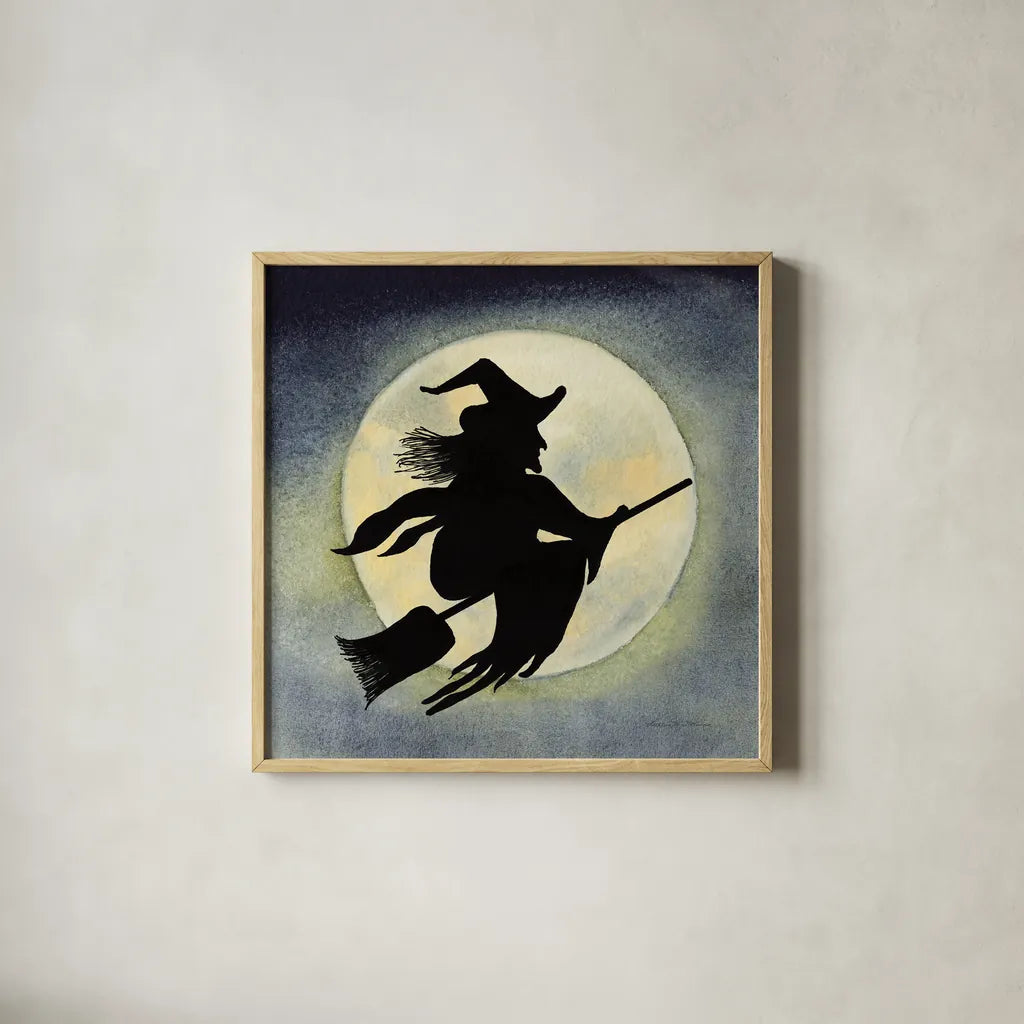 Haunting Halloween Night Witch by Kathleen Parr McKenna. Shown in a natural wood glass frame for a timeless modern aesthetic. Available as an archival giclee rolled canvas, fine art paper, or poster print. SKU 53220a.