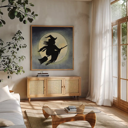 Haunting Halloween Night Witch by Kathleen Parr McKenna. Shown in a natural wood frame in a cozy modern living room. Available as an archival giclee rolled canvas, fine art paper, or poster print. SKU 53220a.