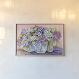 Hydrangeas In Glass by Kathleen Parr McKenna. shown as a paper print in a natural frame. Available as a archival giclee rolled canvas, fine art paper, or poster print. SKU 88421i.