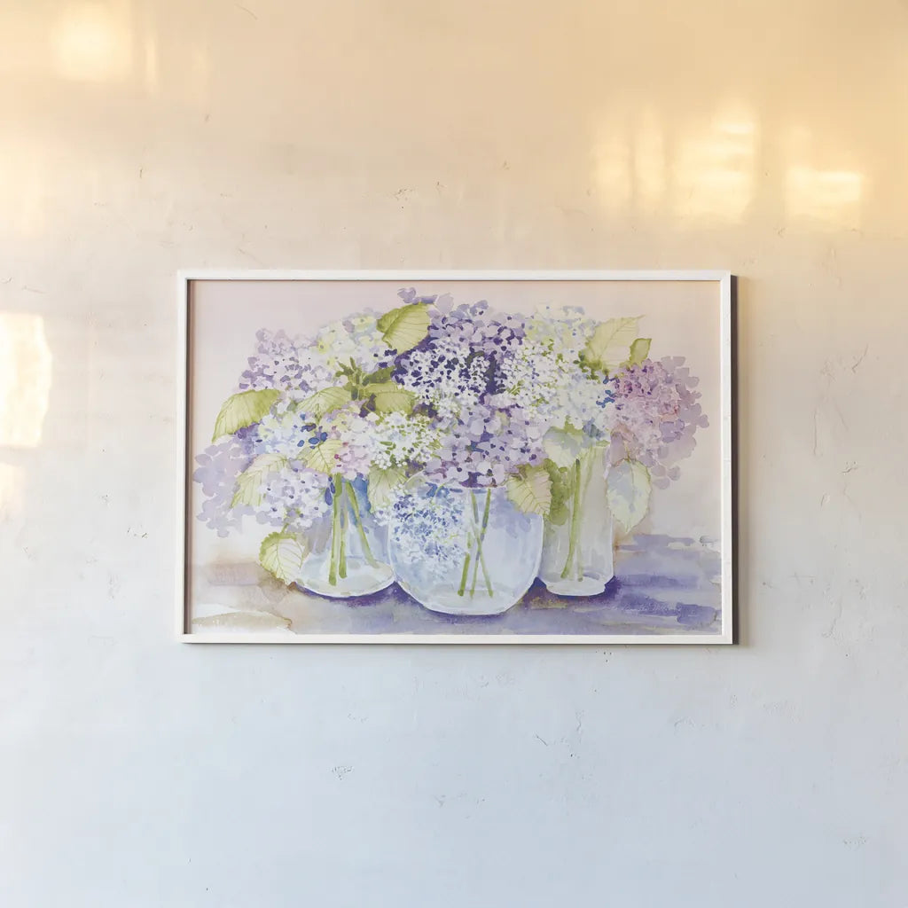 Hydrangeas in Glass Light by Kathleen Parr McKenna. shown as a paper print in a white frame. Available as a archival giclee rolled canvas, fine art paper, or poster print. SKU 89987i.