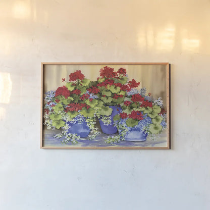 Red Geraniums with The Blues by Kathleen Parr McKenna. shown as a paper print in a natural frame. Available as a archival giclee rolled canvas, fine art paper, or poster print. SKU 88422i.