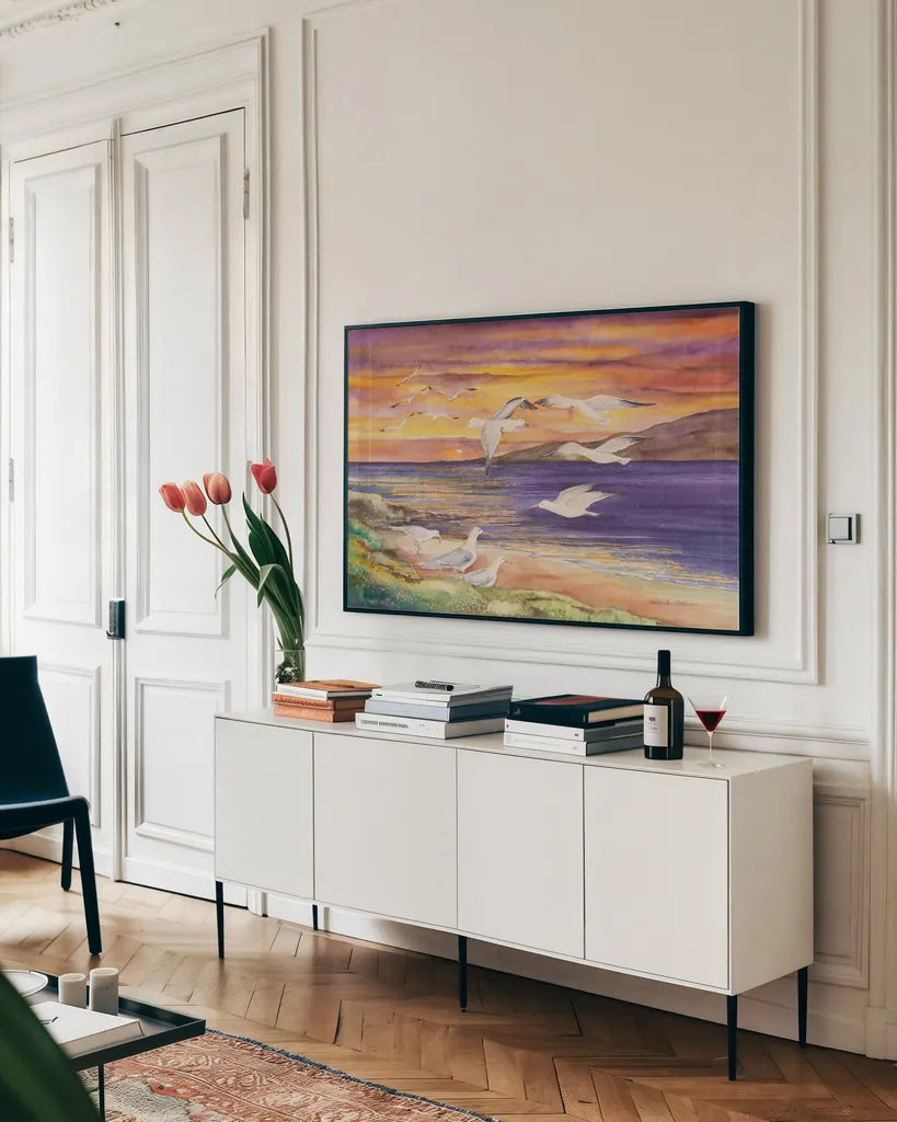 Seagull Sunset by Kathleen Parr McKenna. shown as a framed stretched canvas in a living room above a console. Available as a archival giclee rolled canvas, fine art paper, or poster print. SKU 47973i.
