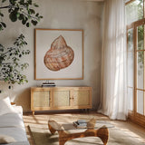 Shells IV by Kathleen Parr McKenna. Shown in a natural wood frame in a cozy modern living room. Available as an archival giclee rolled canvas, fine art paper, or poster print. SKU 16943a.