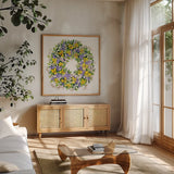 Spring Wreath III by Kathleen Parr McKenna. Shown in a natural wood frame in a cozy modern living room. Available as an archival giclee rolled canvas, fine art paper, or poster print. SKU 24598a.
