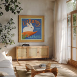 Carrots by Kathrine Lovell. Shown in a natural wood frame in a cozy modern living room. Available as an archival giclee rolled canvas, fine art paper, or poster print. SKU 43331a.