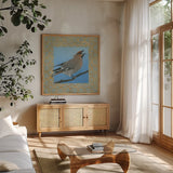 Cedar Waxwing by Kathrine Lovell. Shown in a natural wood frame in a cozy modern living room. Available as an archival giclee rolled canvas, fine art paper, or poster print. SKU 24444a.