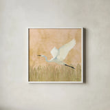 Egret Alighting II Flipped by Kathrine Lovell. Shown in a crisp white glass frame for a clean and minimalist style. Available as an archival giclee rolled canvas, fine art paper, or poster print. SKU 68083a.