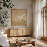 Egret Alighting II Flipped by Kathrine Lovell. Shown in a natural wood frame in a cozy modern living room. Available as an archival giclee rolled canvas, fine art paper, or poster print. SKU 68083a.