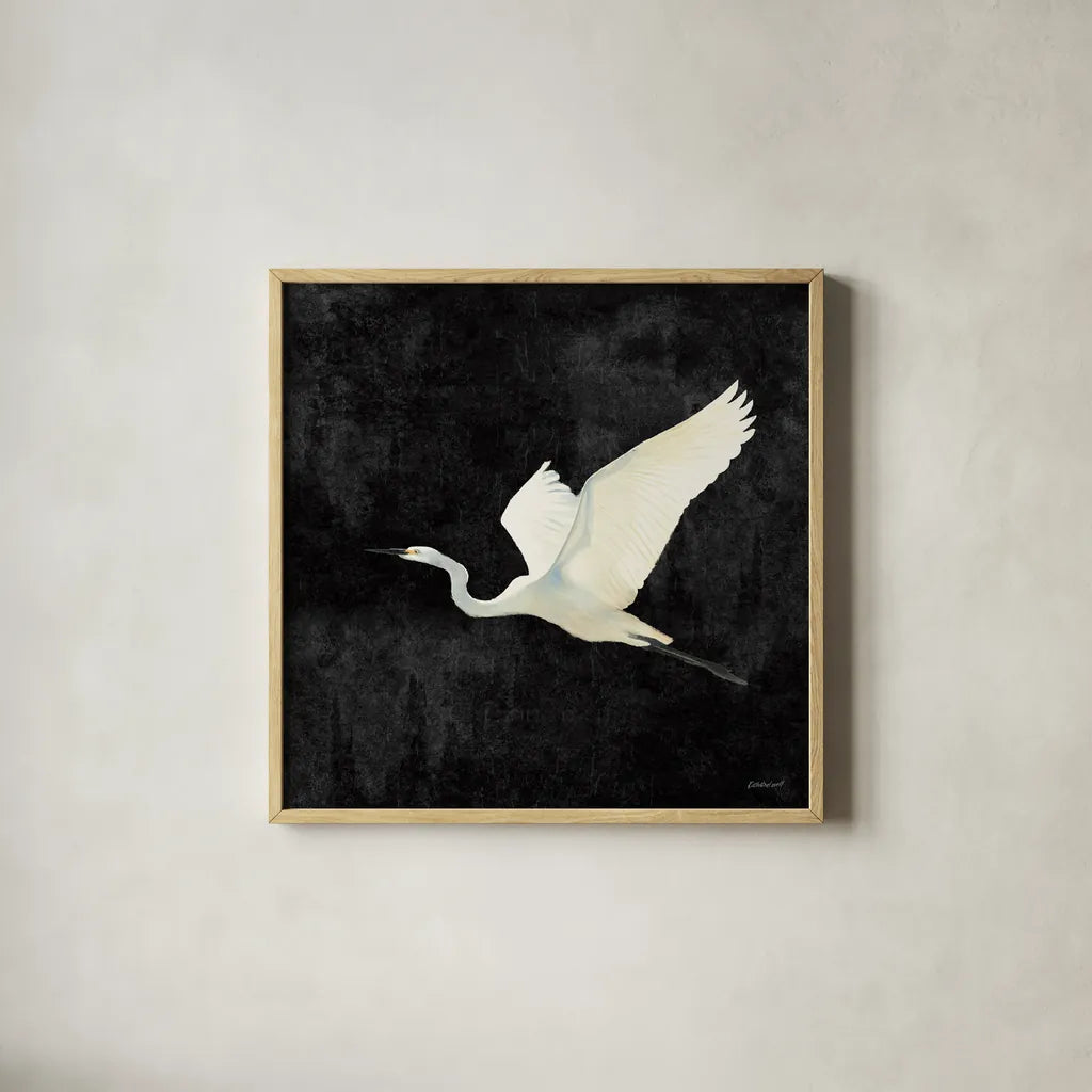 Egret Alighting II Flipped Black by Kathrine Lovell. Shown in a natural wood glass frame for a timeless modern aesthetic. Available as an archival giclee rolled canvas, fine art paper, or poster print. SKU 79055a.