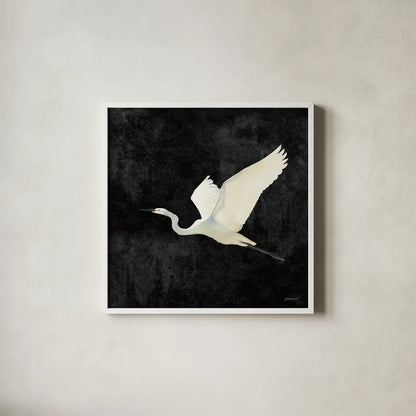 Egret Alighting II Flipped Black by Kathrine Lovell. Shown in a crisp white glass frame for a clean and minimalist style. Available as an archival giclee rolled canvas, fine art paper, or poster print. SKU 79055a.