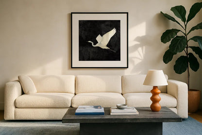 Egret Alighting II Flipped Black by Kathrine Lovell. Displayed in a glass frame with matte in a clean modern living room. Available as an archival giclee rolled canvas, fine art paper, or poster print. SKU 79055a.