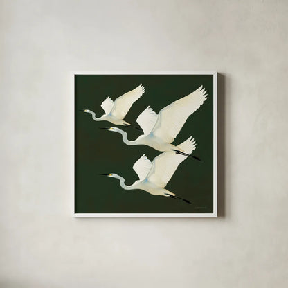 Egrets Alighting II on Green by Kathrine Lovell. Shown in a crisp white glass frame for a clean and minimalist style. Available as an archival giclee rolled canvas, fine art paper, or poster print. SKU 86428a.