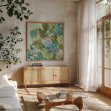 Grandiflora Bloom by Kathrine Lovell. Shown in a natural wood frame in a cozy modern living room. Available as an archival giclee rolled canvas, fine art paper, or poster print. SKU 5087a.