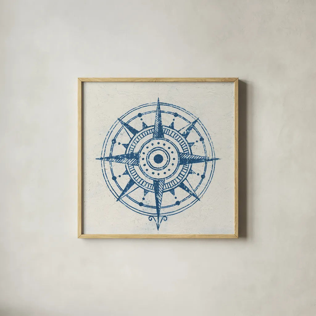 Indigo Gild Compass Rose 1 by Kathrine Lovell. Shown in a natural wood glass frame for a timeless modern aesthetic. Available as an archival giclee rolled canvas, fine art paper, or poster print. SKU 27150a.