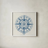 Indigo Gild Compass Rose 1 by Kathrine Lovell. Shown in a crisp white glass frame for a clean and minimalist style. Available as an archival giclee rolled canvas, fine art paper, or poster print. SKU 27150a.