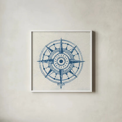 Indigo Gild Compass Rose 1 by Kathrine Lovell. Shown in a crisp white glass frame for a clean and minimalist style. Available as an archival giclee rolled canvas, fine art paper, or poster print. SKU 27150a.