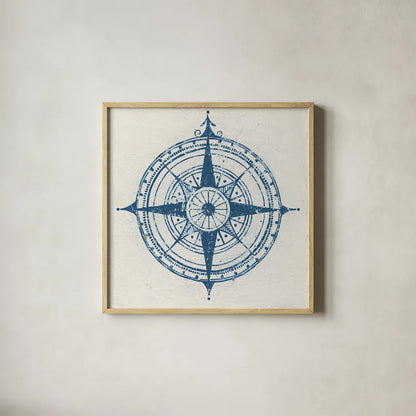 Indigo Gild Compass Rose 2 by Kathrine Lovell. Shown in a natural wood glass frame for a timeless modern aesthetic. Available as an archival giclee rolled canvas, fine art paper, or poster print. SKU 27151a.