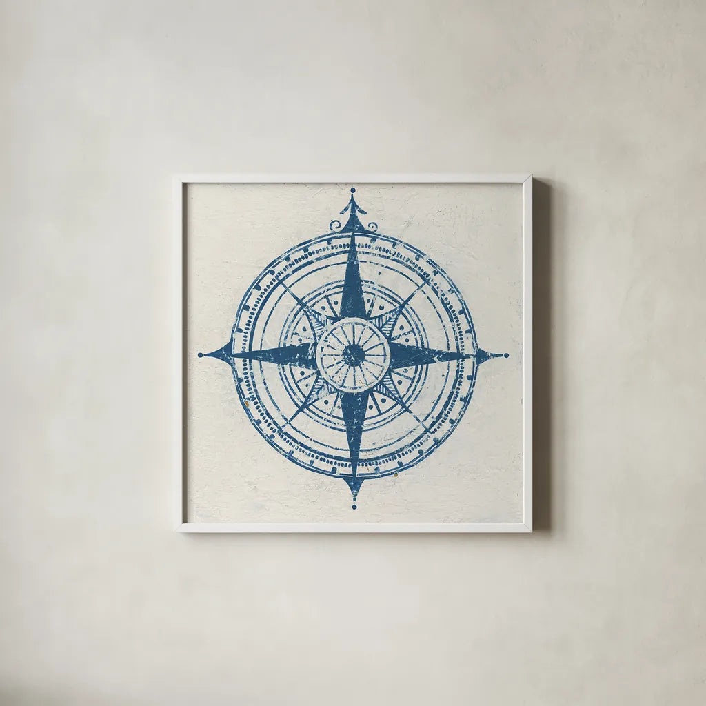 Indigo Gild Compass Rose 2 by Kathrine Lovell. Shown in a crisp white glass frame for a clean and minimalist style. Available as an archival giclee rolled canvas, fine art paper, or poster print. SKU 27151a.