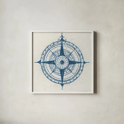 Indigo Gild Compass Rose 2 by Kathrine Lovell. Shown in a crisp white glass frame for a clean and minimalist style. Available as an archival giclee rolled canvas, fine art paper, or poster print. SKU 27151a.