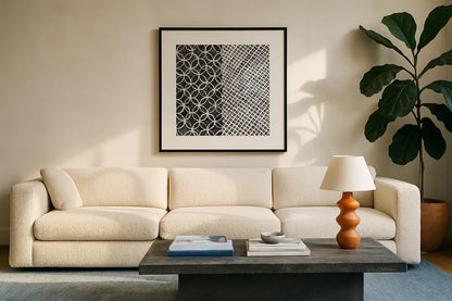 Maki Tile III BW by Kathrine Lovell. Displayed in a glass frame with matte in a clean modern living room. Available as an archival giclee rolled canvas, fine art paper, or poster print. SKU 25403a.