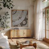 Silver Lakai Circle II Square III by Kathrine Lovell. Shown in a natural wood frame in a cozy modern living room. Available as an archival giclee rolled canvas, fine art paper, or poster print. SKU 28013a.